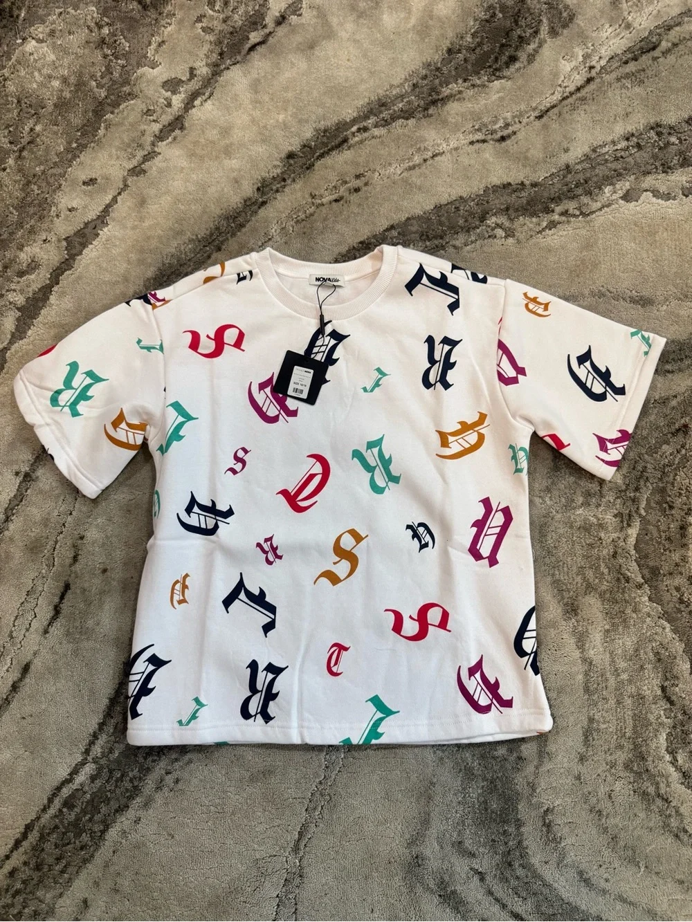 Fashion Nova Kids White Graphic Logo Tee with Multicolor Letters